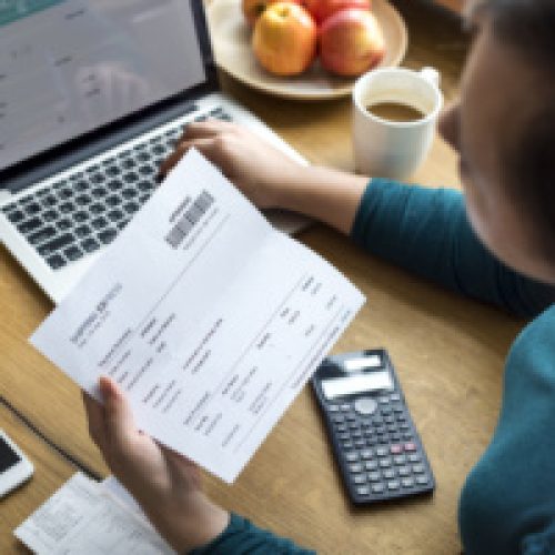 Woman checking shipping letter